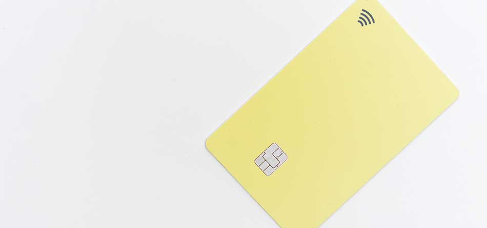 Yellow credit card on a white background